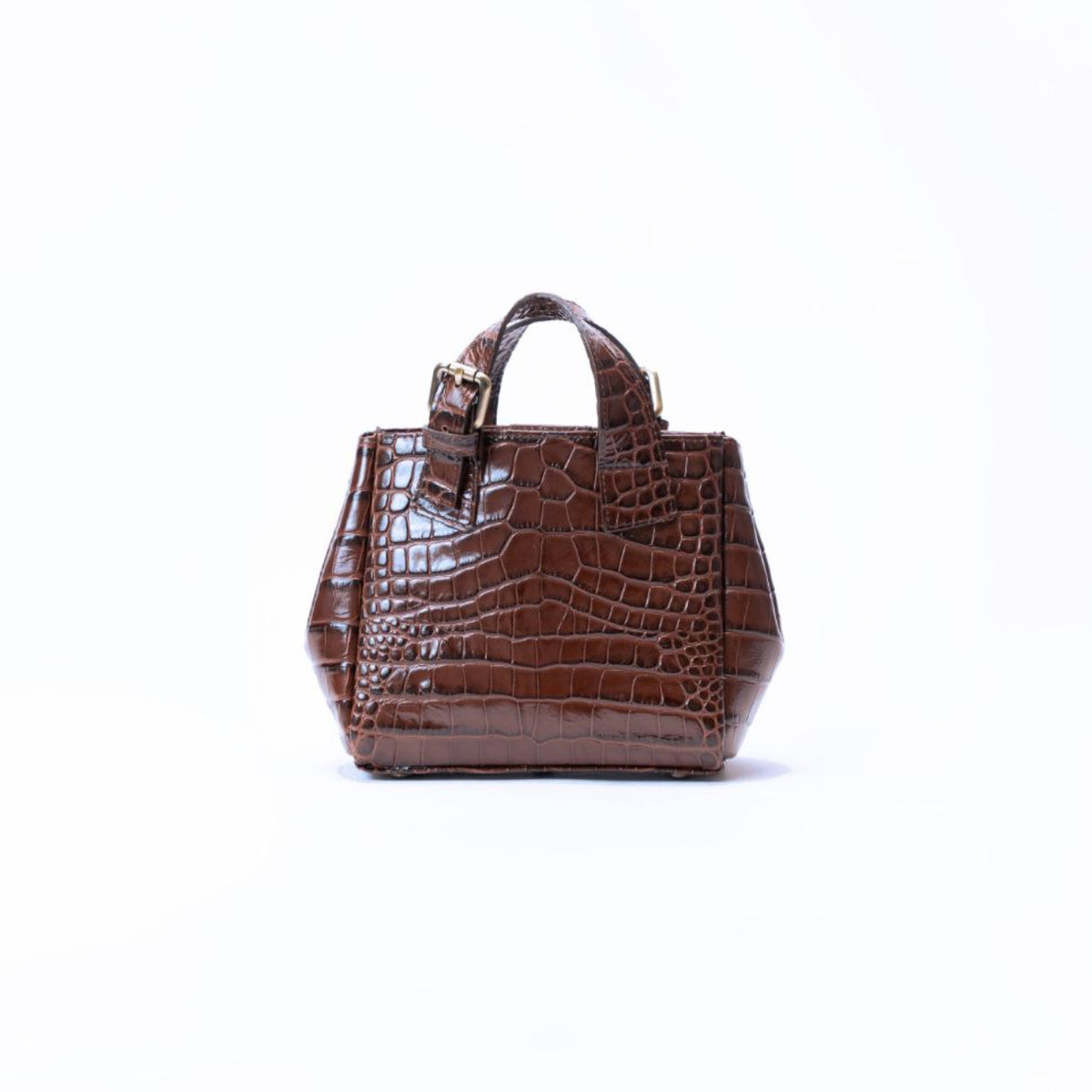 A small brown crocodile-embossed leather handbag with top handles, shown against a plain white background.