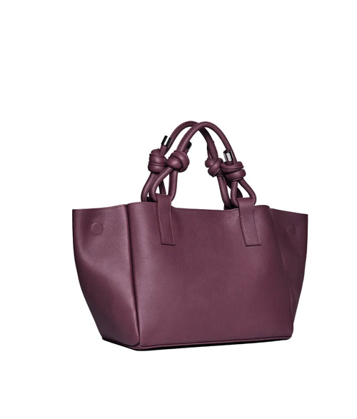 Purple handbag with knotted handles